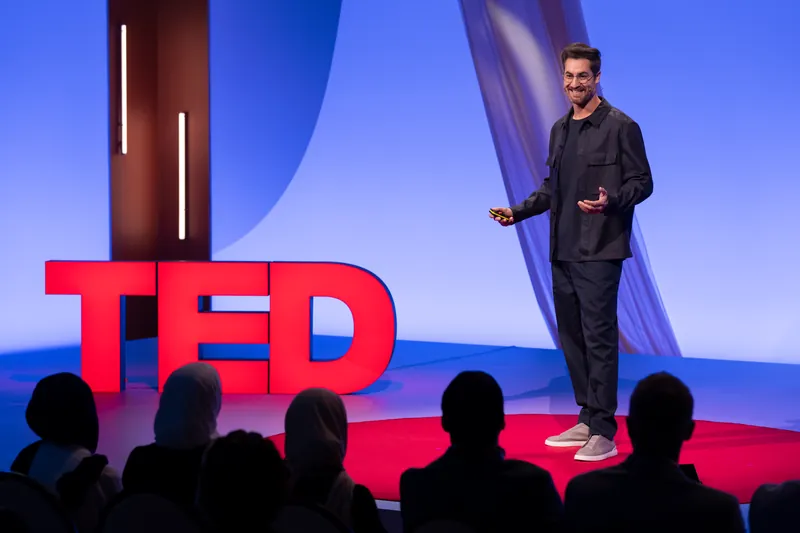 Riyad Joucka speaking on the TED stage in Dubai, 2025