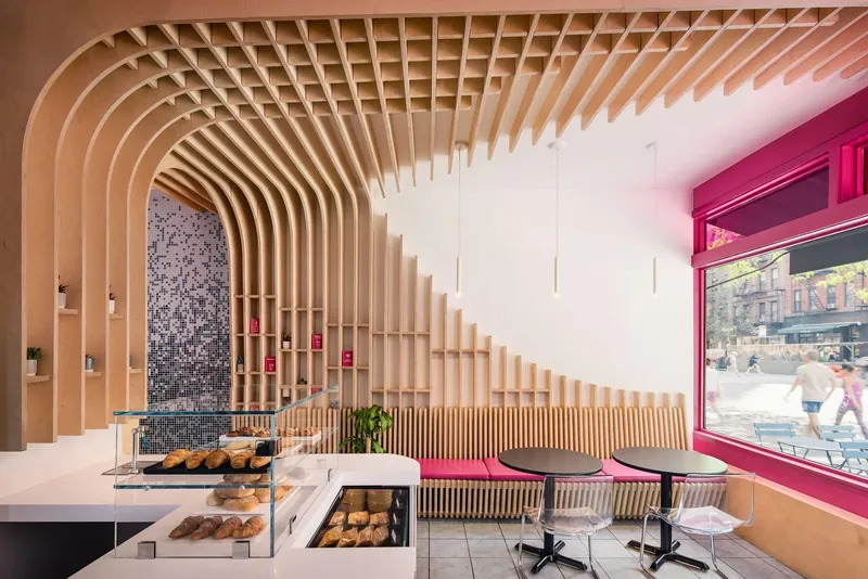 The Migrant Kitchen, New York: curved timber ribs over the counter and window seating